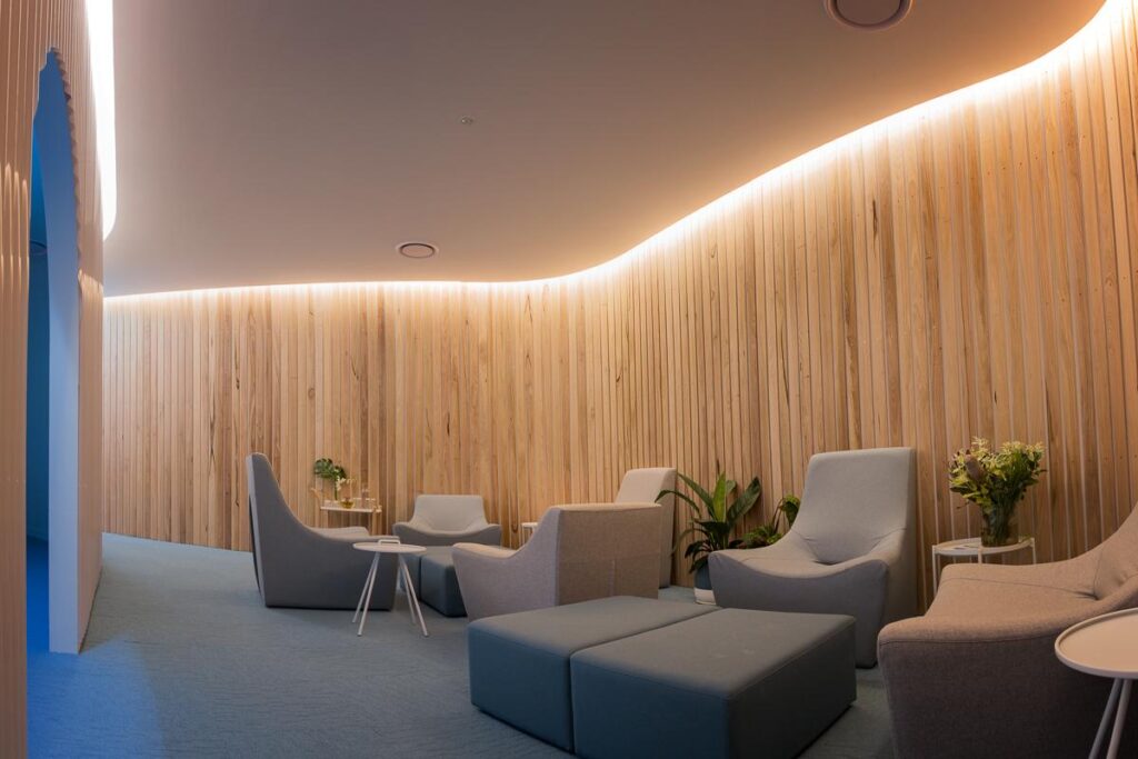 Modern float pod with wooden interior at Beyond Rest wellness center