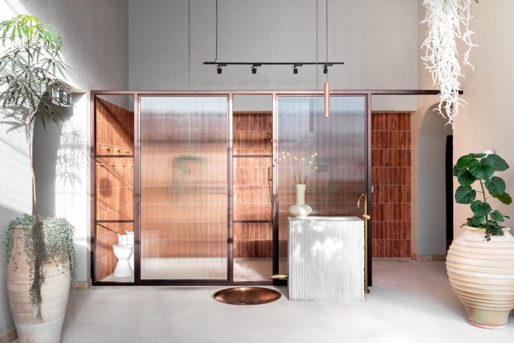 Brick interior with warm lighting and plants at Sense of Self spa Melbourne