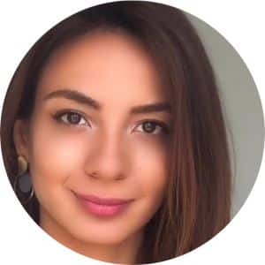 Portrait headshot of a woman with dark hair and warm smile