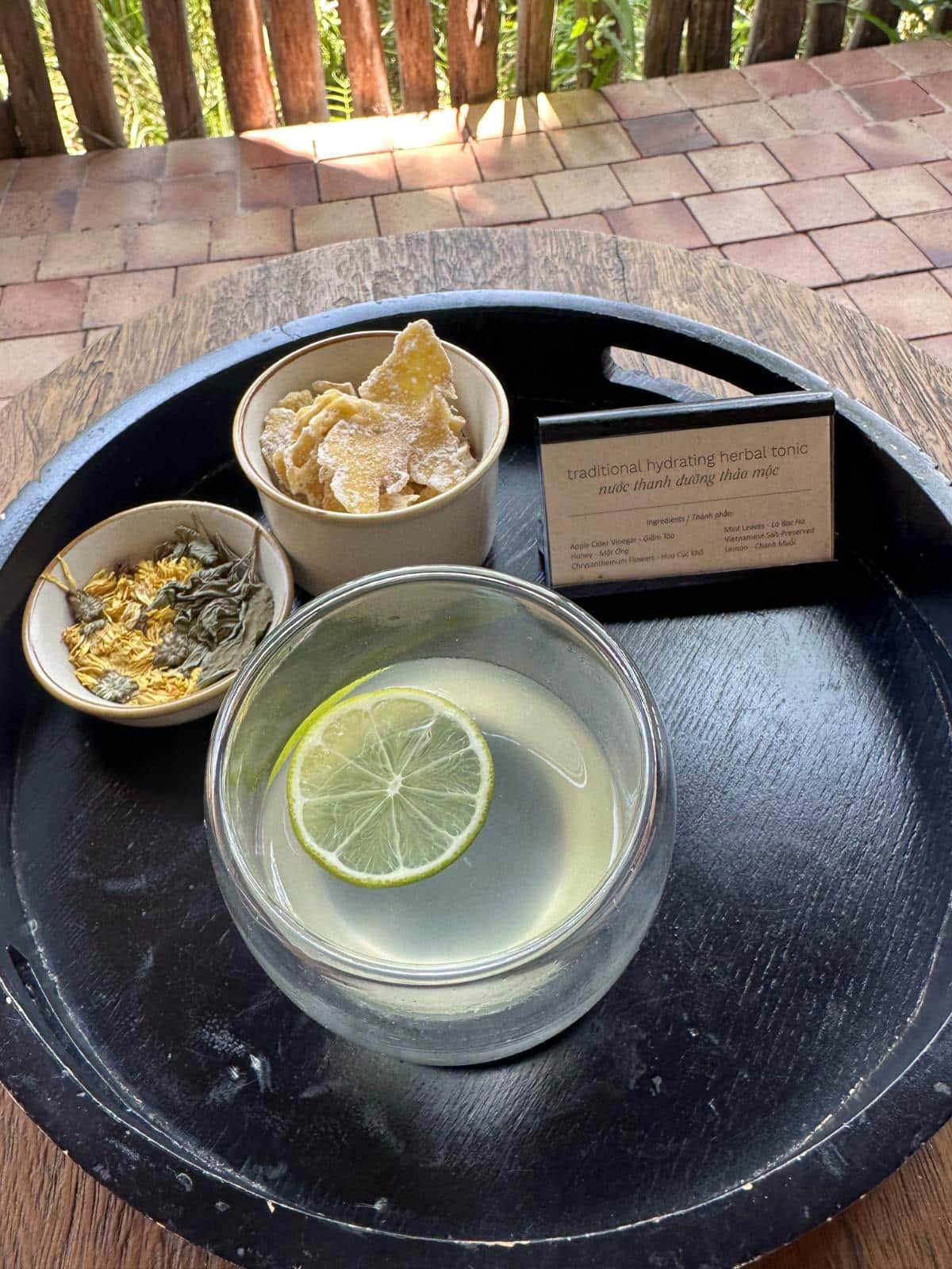 Traditional Vietnamese herbal tonic ingredients on a tray, Namia River Retreat wellness amenity, Hoi An, Vietnam
