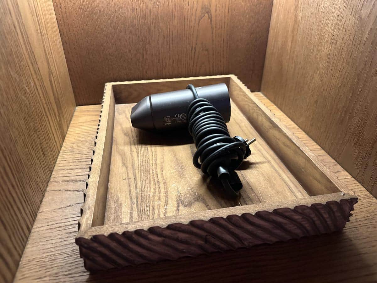 Dyson hairdryer in a wooden tray drawer inside the villa, Namia River Retreat, Hoi An, Vietnam
