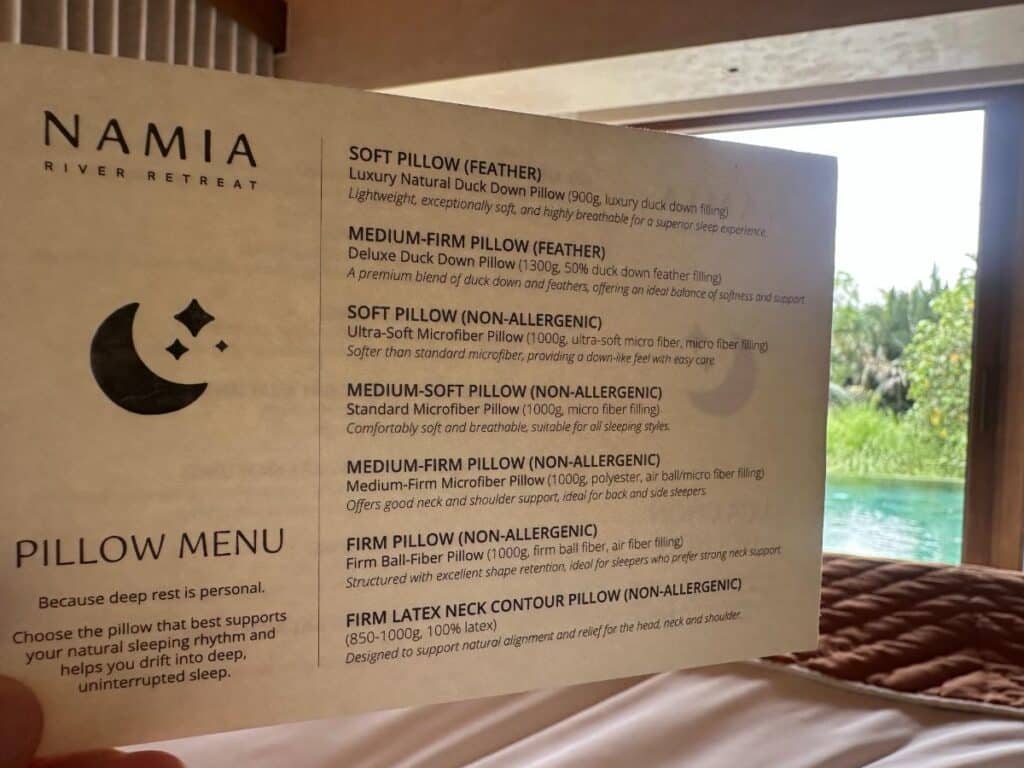 Namia pillow menu card on the bed listing seven pillow options, Namia River Retreat, Hoi An, Vietnam