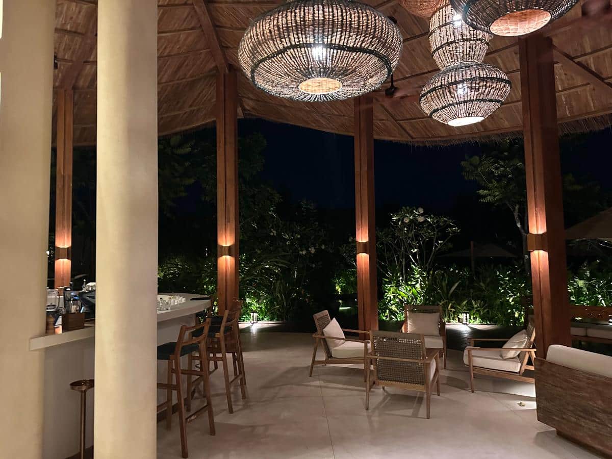 Lobby pavilion with sculptural crystal chandelier at night, Namia River Retreat, Hoi An, Vietnam