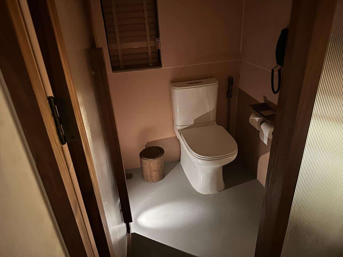 Private water closet with separate door inside the pool villa bathroom, Namia River Retreat, Hoi An, Vietnam