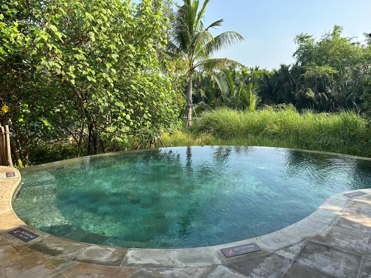 Private plunge pool overlooking tropical jungle from the villa terrace, Namia River Retreat, Hoi An, Vietnam