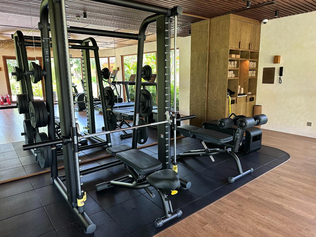 Free weight rack and bench press station in the gym, Namia River Retreat, Hoi An, Vietnam