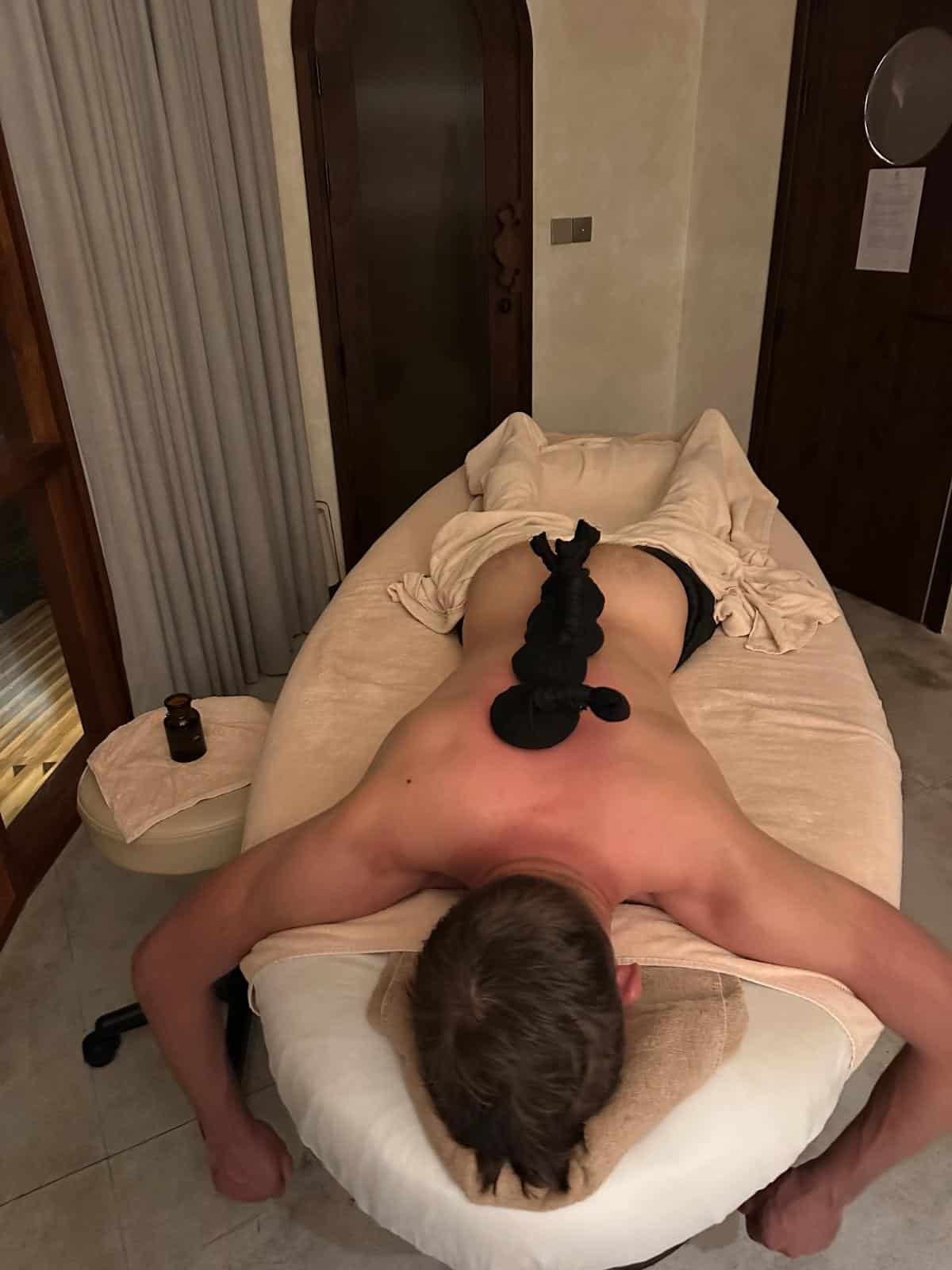 Vietnamese hammam ritual with herbal scrub applied to the back, Namia River Retreat spa, Hoi An, Vietnam